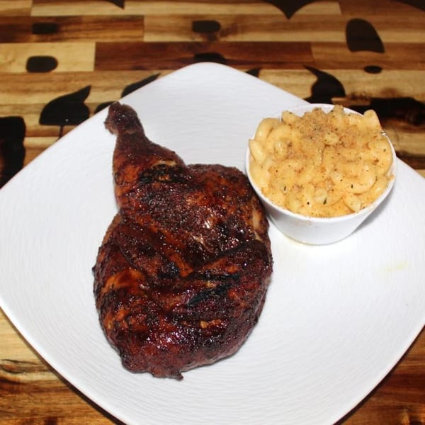 BBQ House Bar & Grill's grilled chicken leg quarter with a side of mac and cheese.